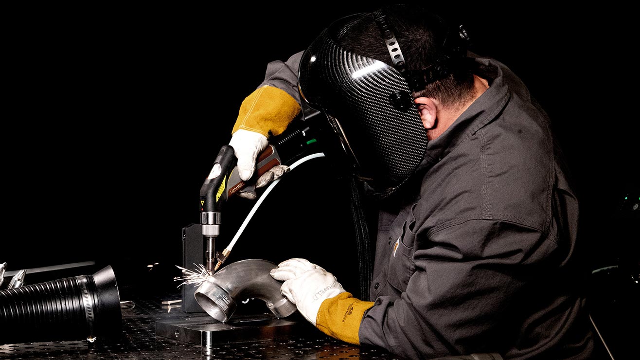 A welder using laser welding to fabricate a pipe