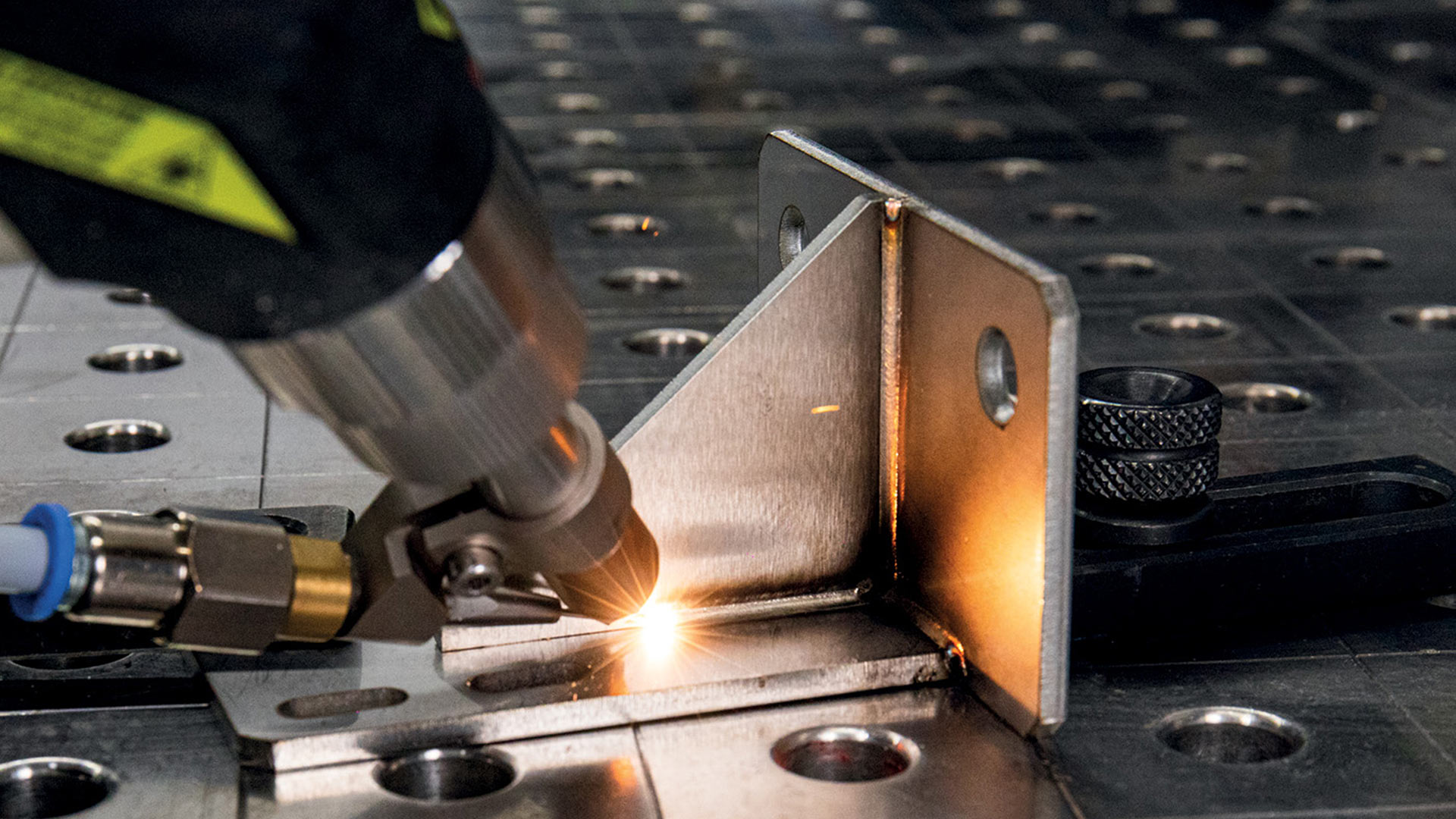 Close up of handheld laser welding a small part